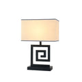 Retro style table lamp with fabric lampshade, iron frame, and remote control switch on a bedside table