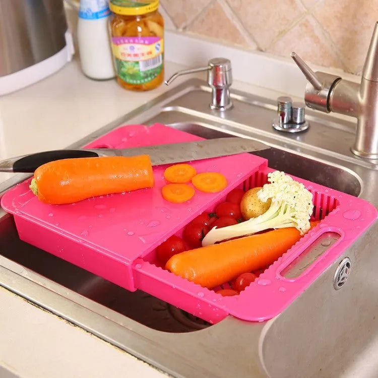 Blue multifunction kitchen chopping board with integrated plastic sink drain basket for vegetable preparation