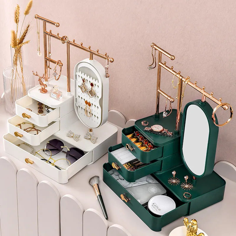 Cosmetics storage box with mirror in pearl white plastic, 27x17x18cm, on desktop with makeup items