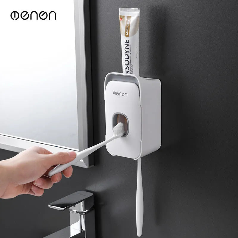 Blue automatic toothpaste dispenser mounted on a bathroom wall with motion sensor.