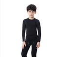 Children's sportswear set showing black and green T-shirts with shorts and trousers alongside size measurement chart