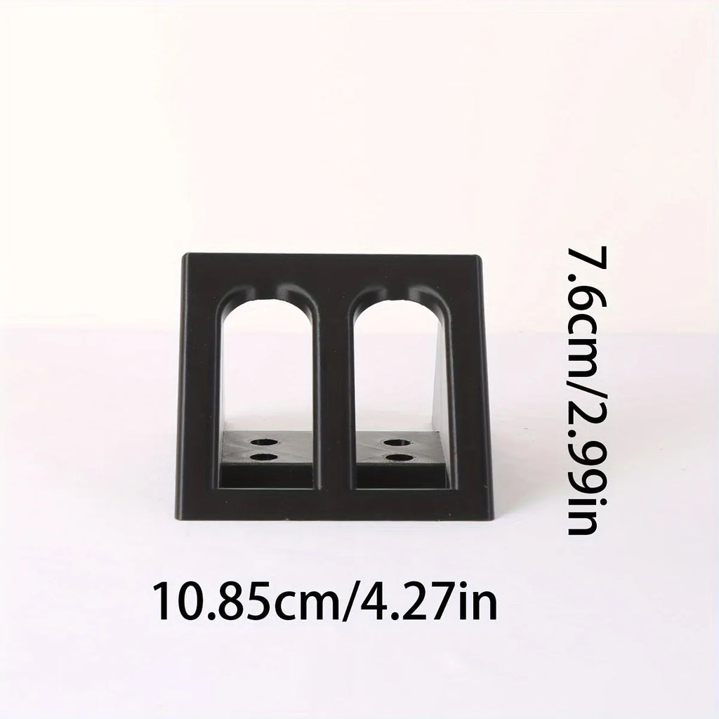 Black punk-style plastic pistol display stand measuring 10.85 by 7.6 centimetres.