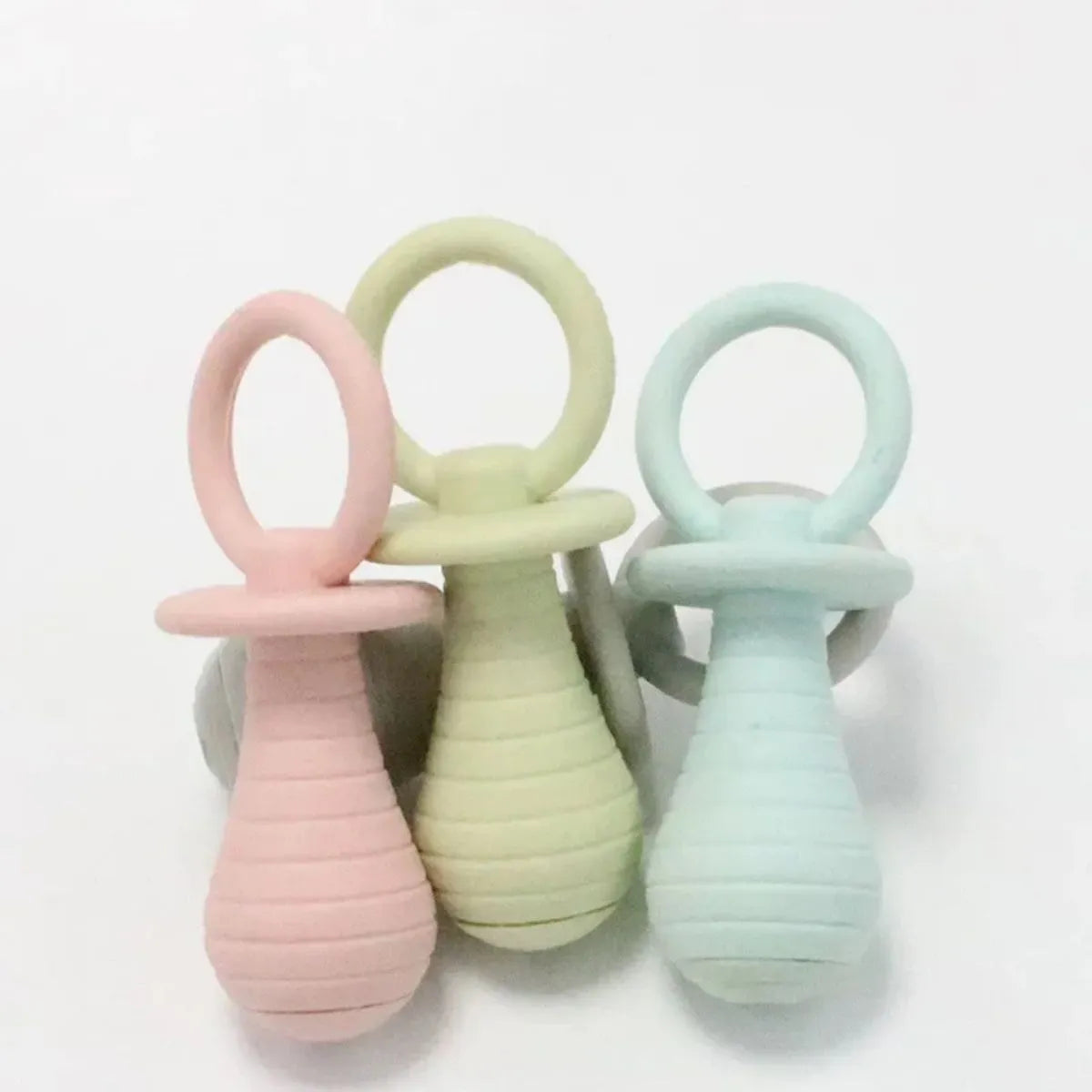 Four coloured pet pacifier rubber toys with squeakers for puppies and kittens