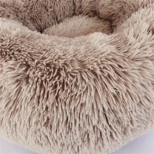 Round long hairy cat bed in plush fabric with anti-slip bottom for autumn and winter
