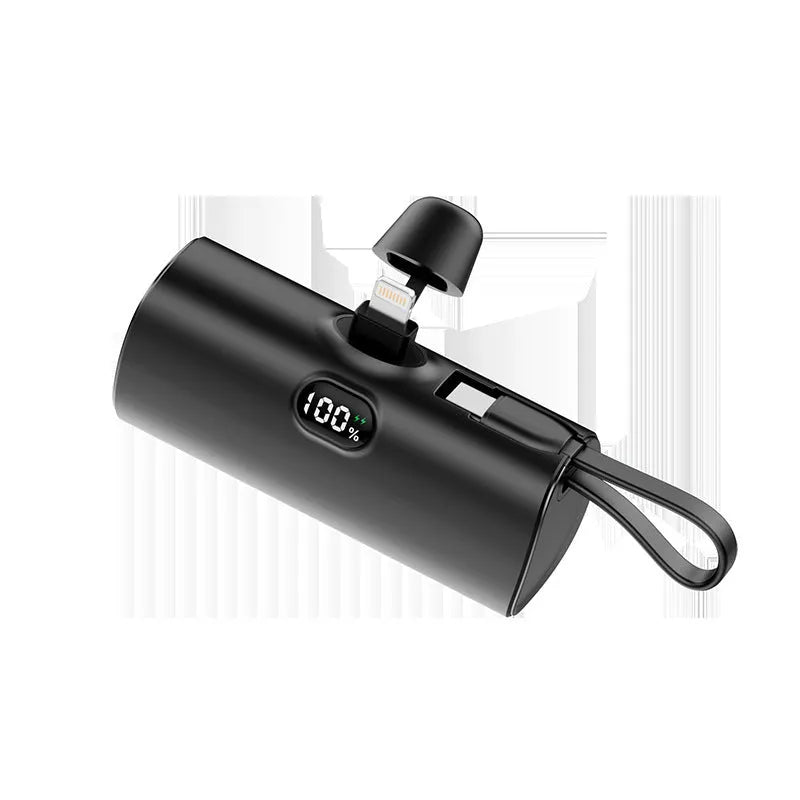 Capsule-shaped digital display power bank in multiple colours showing its size and built-in plug.