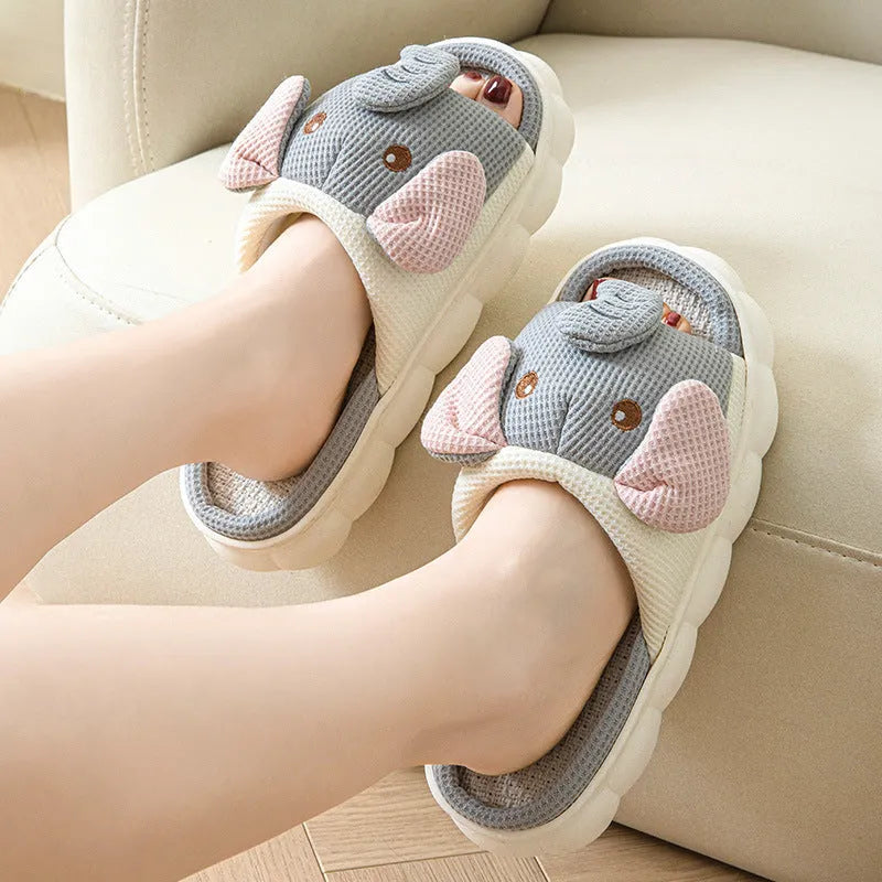 Elephant grey linen open toe slippers for couples with PVC soles on wooden floor