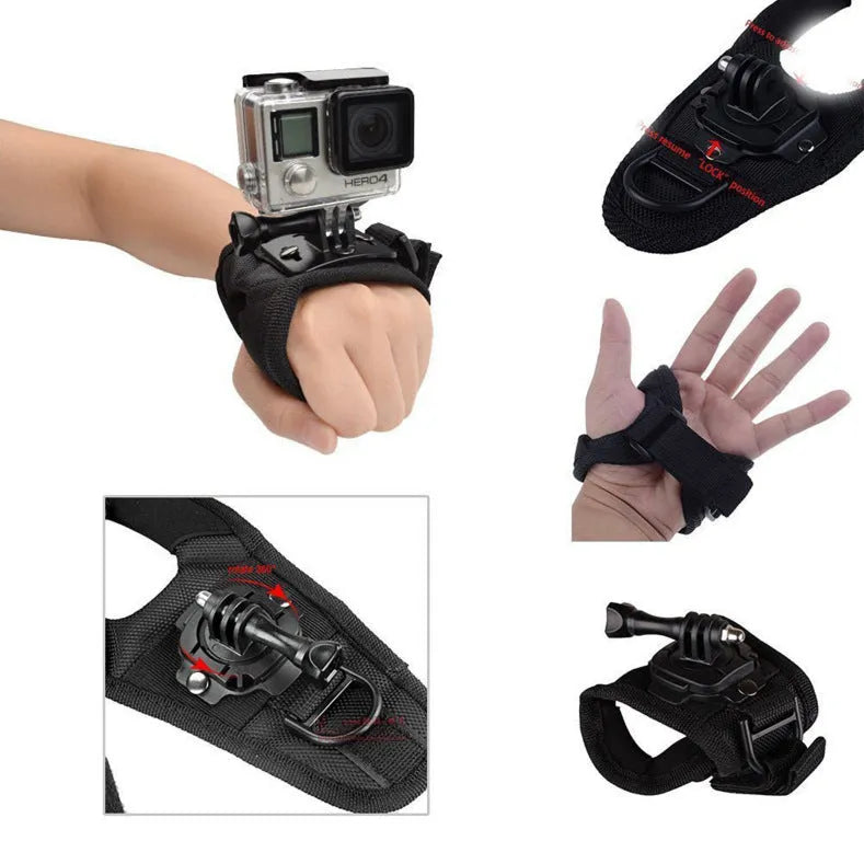 Black GoPro wrist strap with 360-degree rotating camera mount on a palm