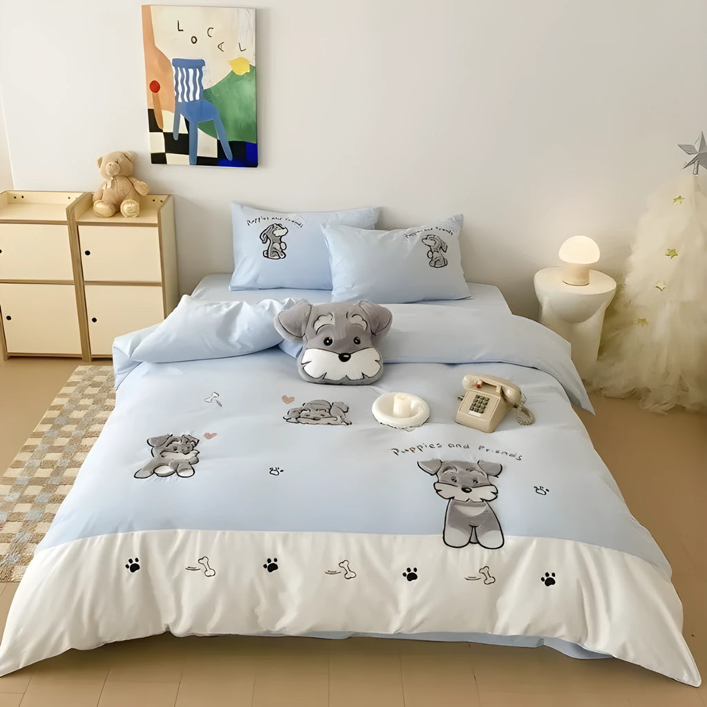 Cartoon Schnauzer design embroidered on a light blue cotton quilt cover and pillowcase.