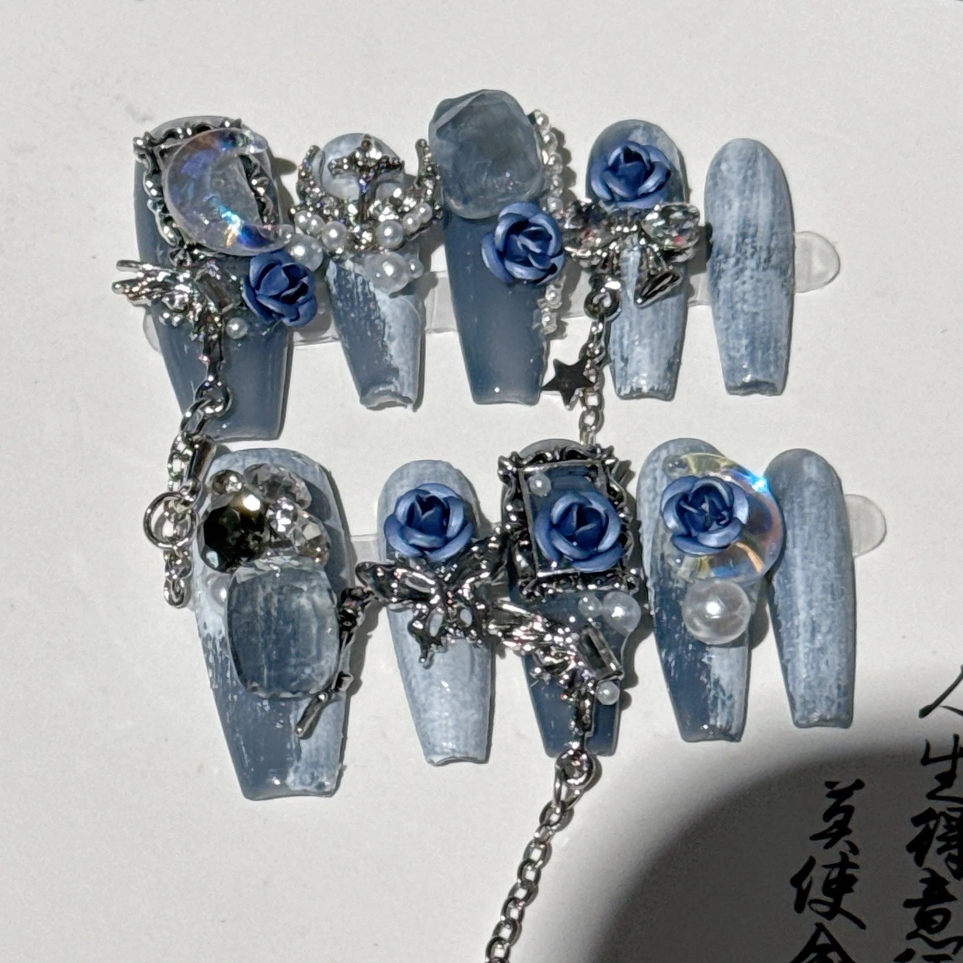 Heavy industry blue false nails with ornate rose and tulip floral pattern design in sizes XS S M L