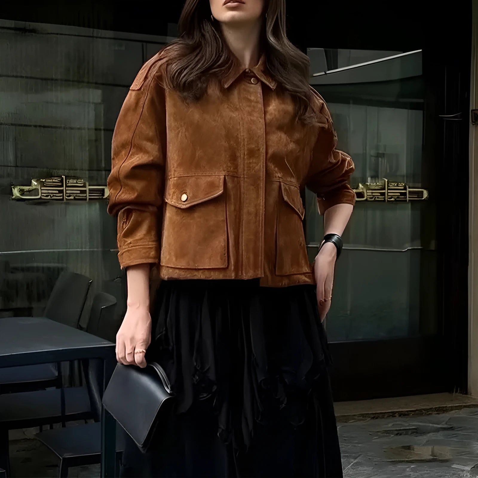 Bright brown women's suede-style polyester coat with regular sleeves on a hanger.