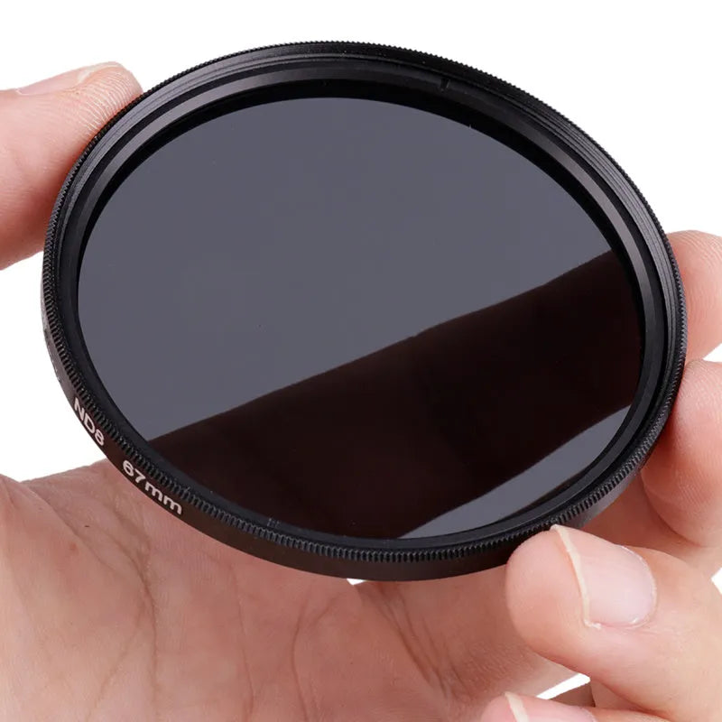 Slim aluminium ND8 camera filter showing front glass and threaded mount, with size markings visible.
