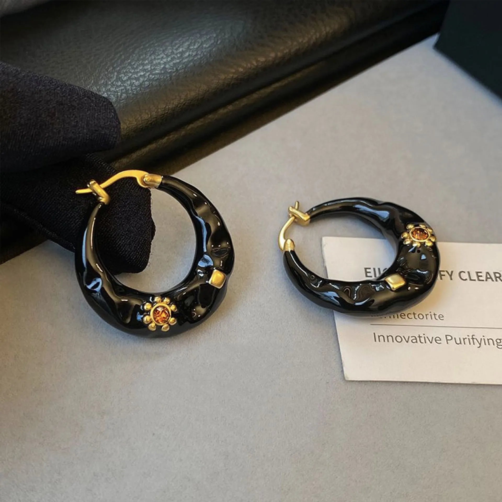 Hong Kong style retro stud earrings with dripping oil finish and rhinestone accents in black and red colours