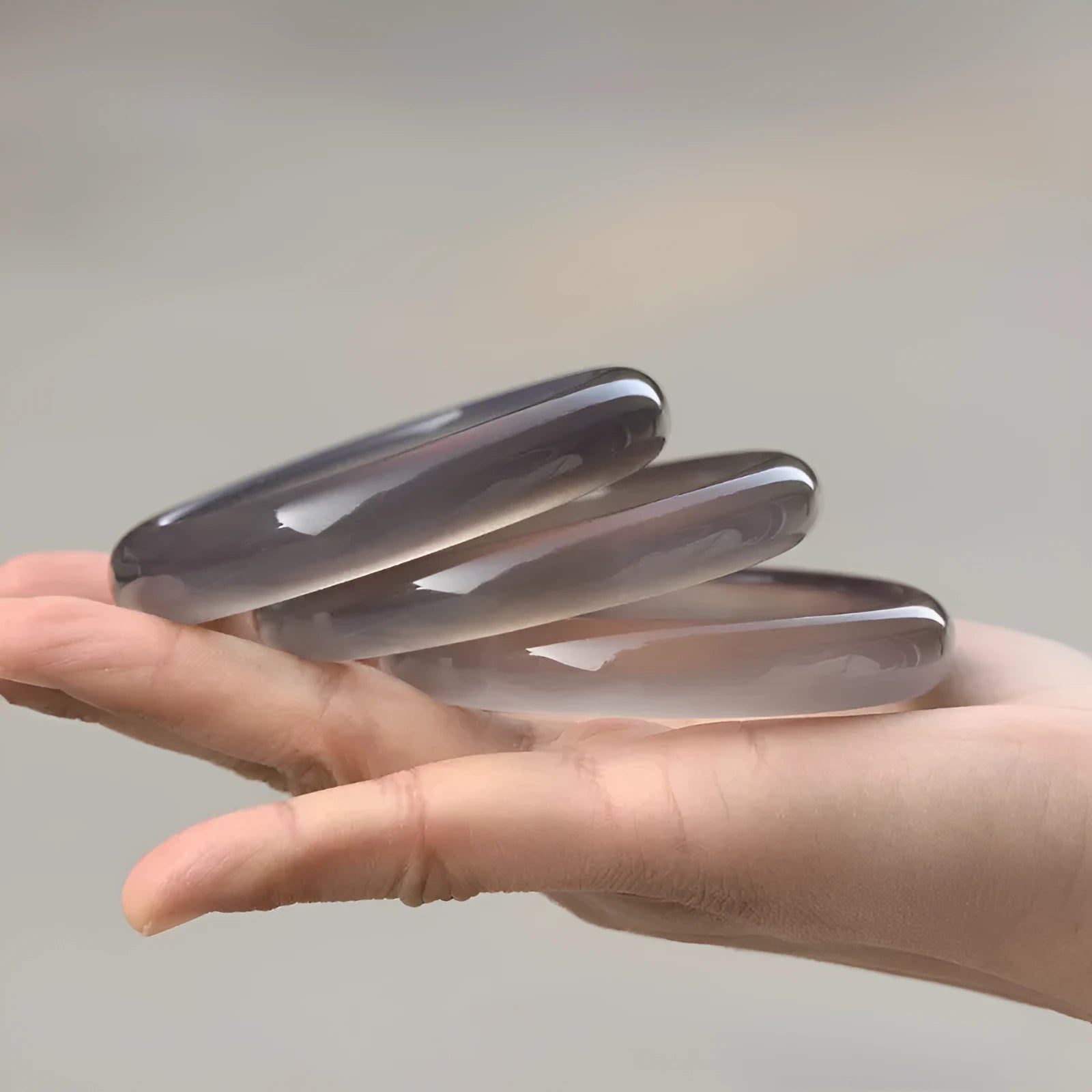 Dark grey iced chalcedony agate women's bracelet with circle, ring and line design elements