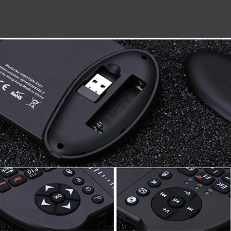 Black wireless QWERTY keyboard air mouse combo with touchpad, 146.8x97.5x19mm, on a table