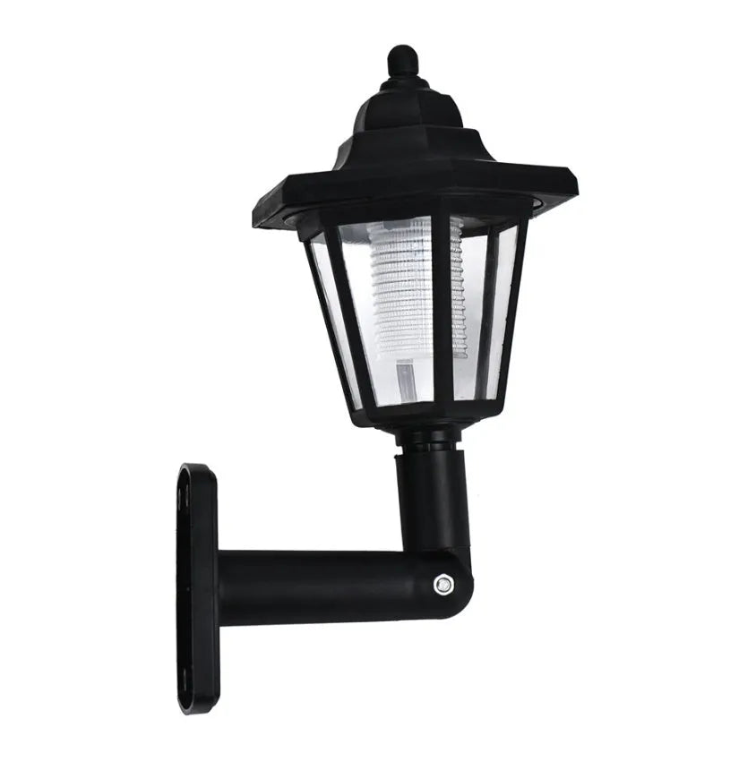 Black hexagonal solar-powered wall lamp for outdoor garden use.