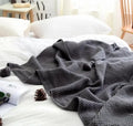 Nordic fringed knit ball blanket measuring 130×170cm in acrylic fabric