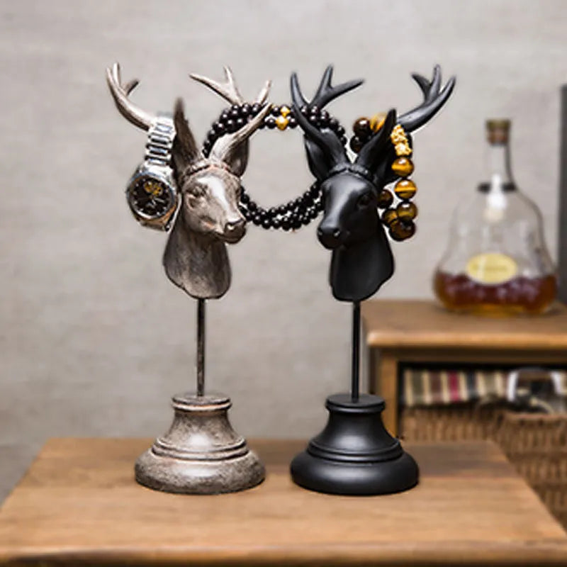 A solid natural resin animal-shaped home decoration in black, shown from the side.