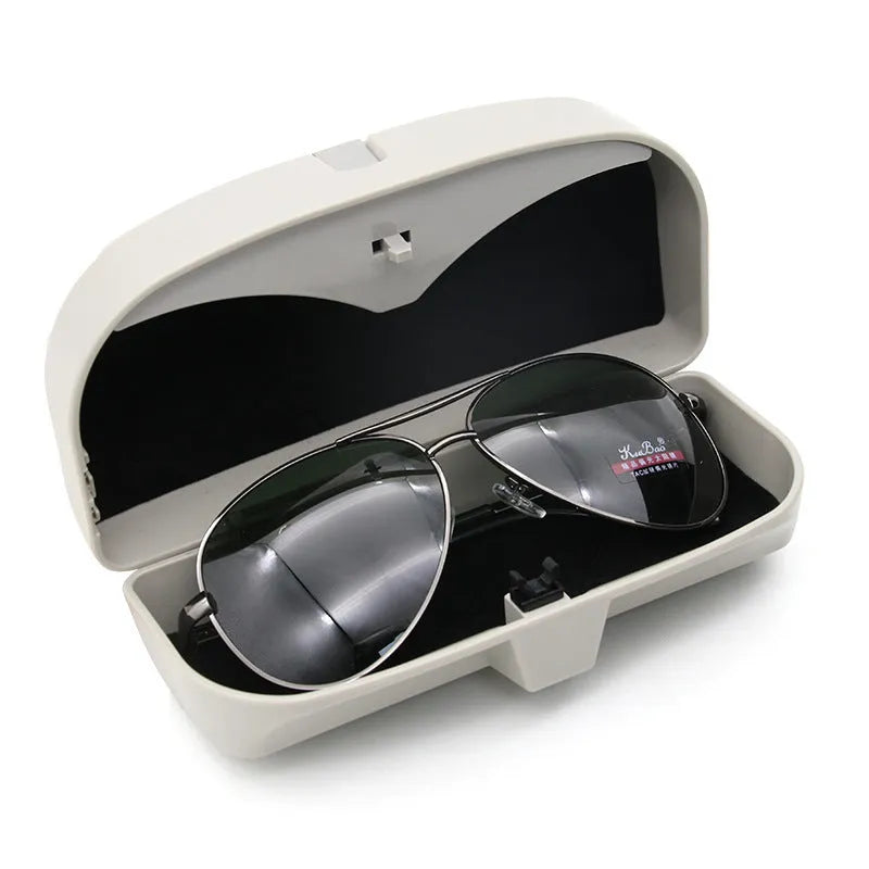 Car glasses case clipped onto sun visor, 170x70x55mm, silver coated tape and steel wire construction