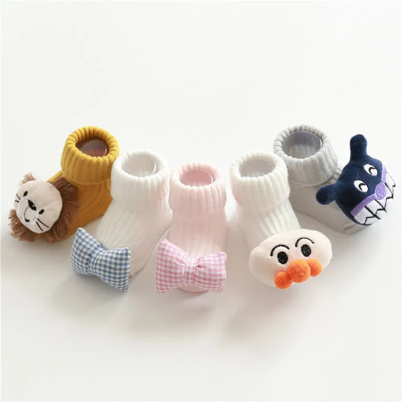 Cotton baby socks in various colours and patterns including bows, stars, and animal designs