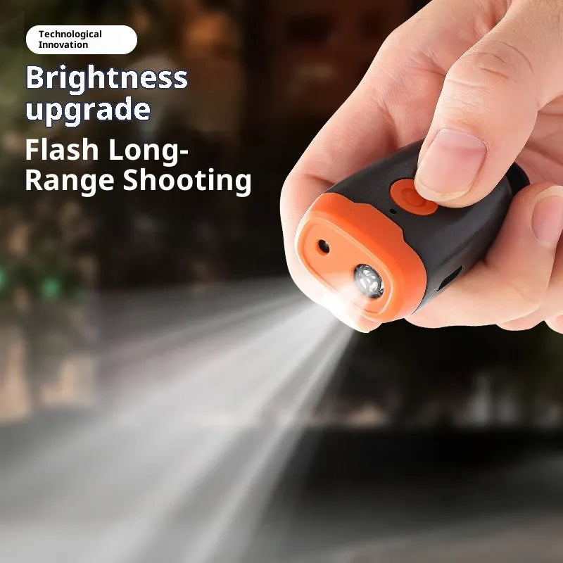 Mini ultrasonic dog dispeller in black and orange ABS casing measuring 3x2x6cm
