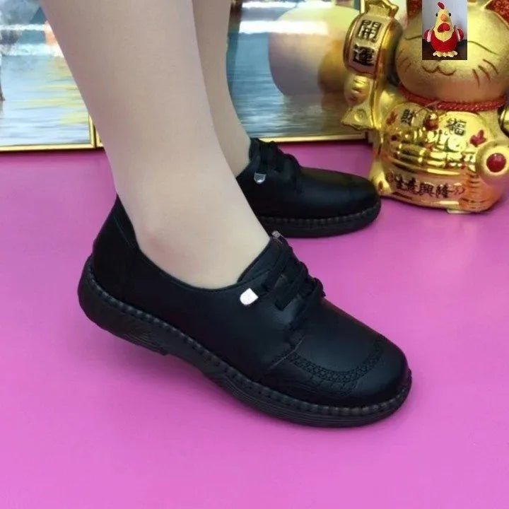 Women's soft leather low heel shoes in black with front lace-up and non-slip rubber sole