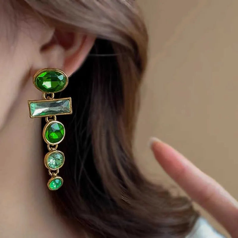 Pair of green gradient geometric alloy earrings with inlaid zircon stones and a dangling tassel.