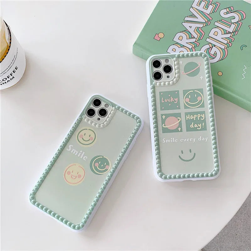 Green TPU iPhone case with geometric smiley face and polka dot frame design