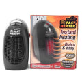 Black mini electric heater with digital display and a rotating three-prong plug on a desk.