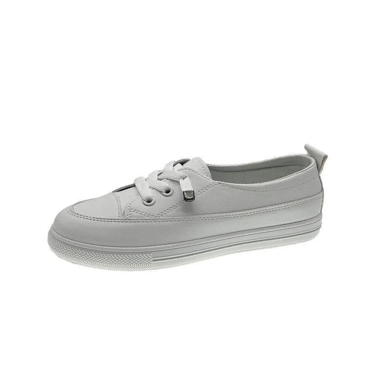 White women's sports breathable shoes with patent leather upper, flat heel, round toe, and front lace-up on a plain background