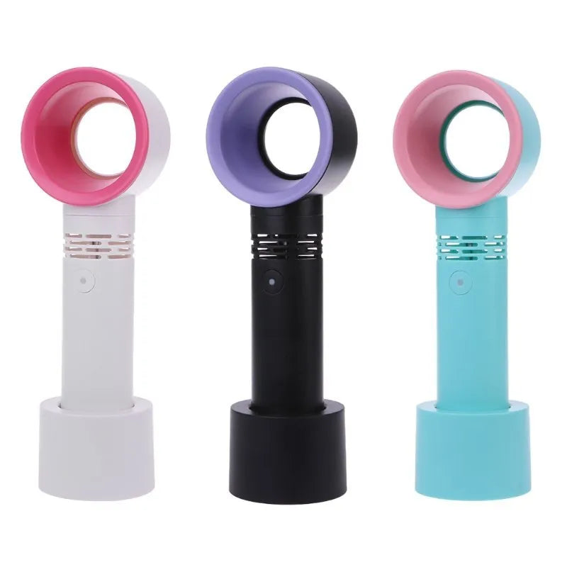 A compact portable bladeless fan with USB cable on a desk.