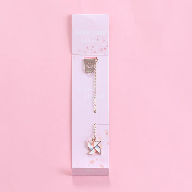 Alloy metal bookmark with cartoon pendant designs including panda, rocket and unicorn variations