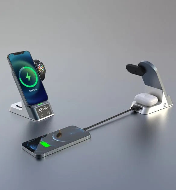 Black six-in-one wireless charging alarm clock showing phone, Apple Watch, and earphones on charging areas.