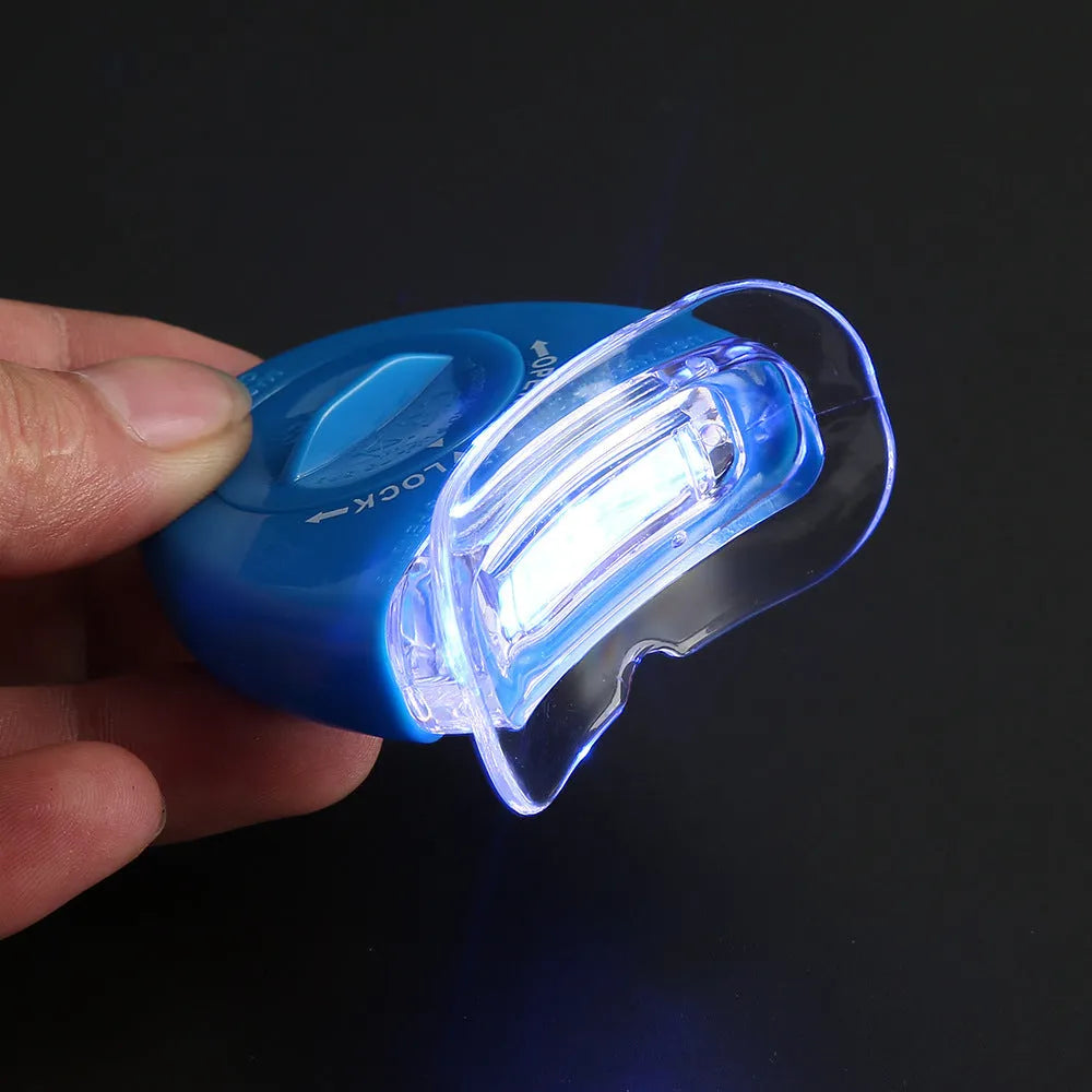 LED teeth whitening kit with wide edge tray and buckle denture system, available in blue, white, or red