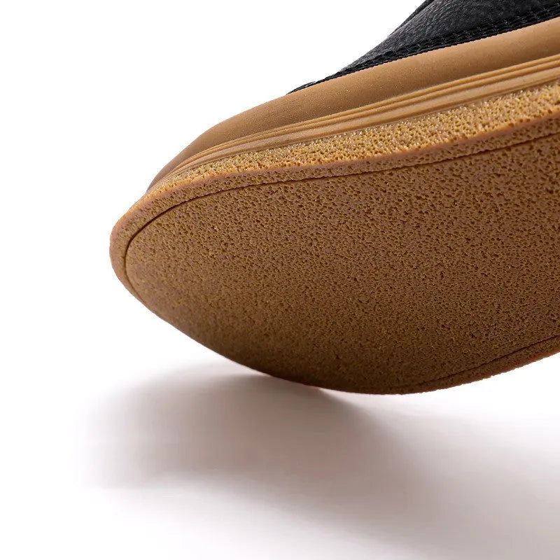 Men's black leather casual shoes with a round toe, flat heel, and lace-up closure on a rubber sole.