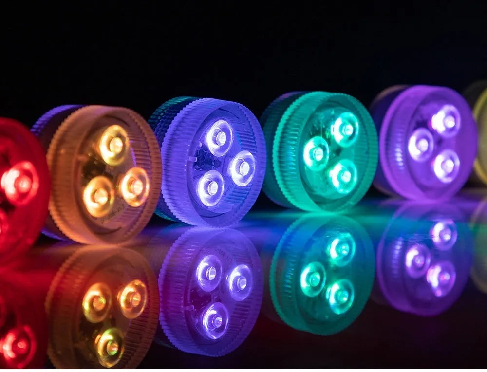 Small white rectangular submersible LED light with remote control for aquarium colour lighting.