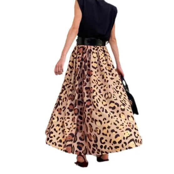 Brown leopard print women's A-line long skirt with a deep, flowing hem on a hanger.