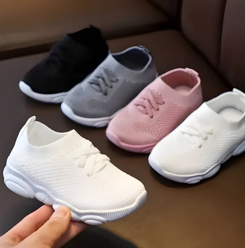 Children's lazy slip-on shoes in fabric with non-slip rubber sole, shown in available colours.