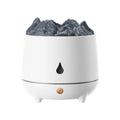 White volcano-shaped ultrasonic humidifier with USB cable on a table