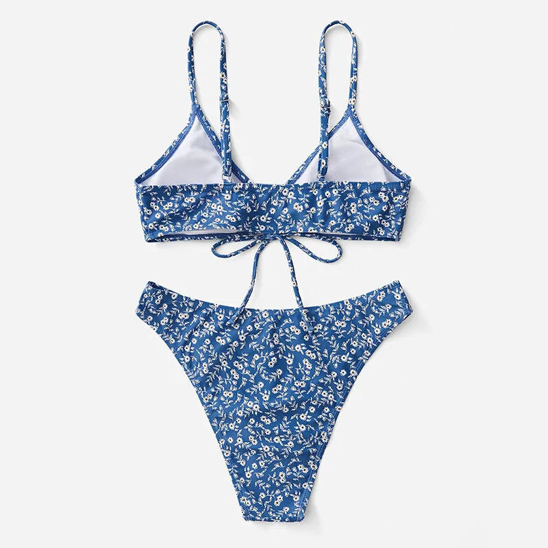 Blue polyester three-piece swimsuit set for women, featuring a halter top and boy short bottoms.