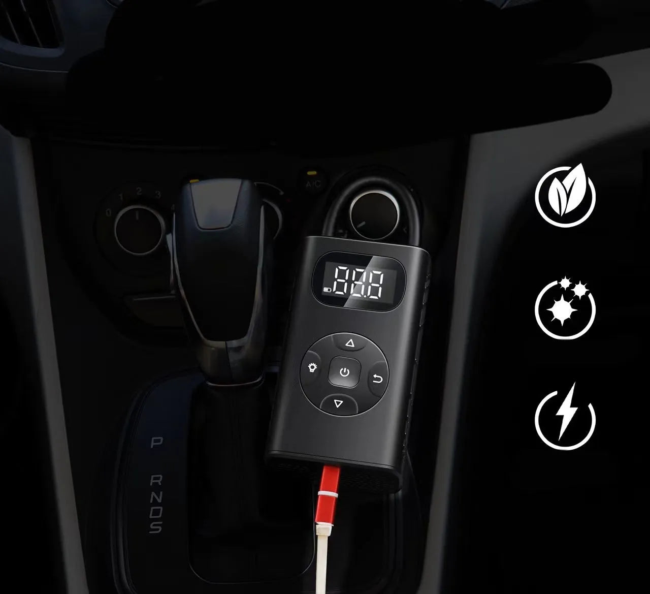 Black portable power bank tyre inflator with USB cable on a grey background.