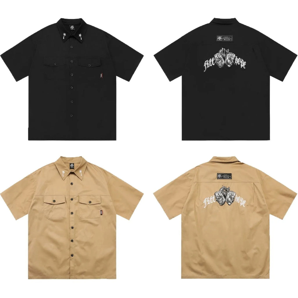 Man's black loose-fit pocket shirt with embroidery and half sleeves on a hanger.