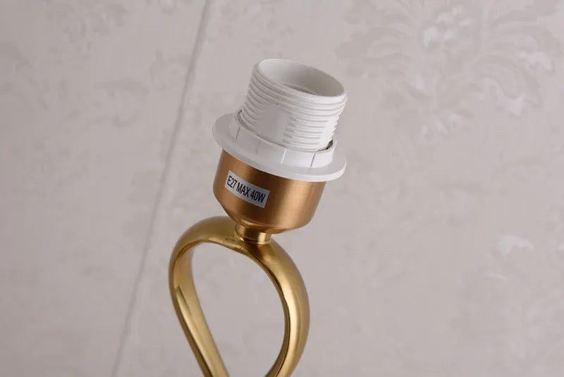 Creative bedside lamp with electroplating imitation copper finish, white colour, on a bedside table with button switch and UK plug