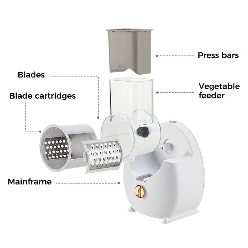 White electric vegetable slicer with rotary grater, suction base, and multiple blades on a kitchen counter.