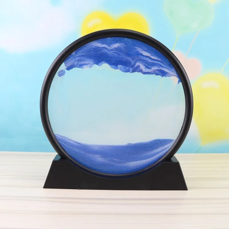 3D dynamic sand painting in glass frame with shifting blue and purple sand patterns