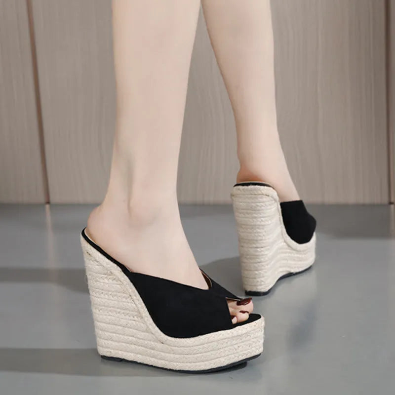 Women's black suede open toe high heel sandals with rubber sole, side view