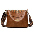 Brown PU messenger bag with multiple compartments and cross body strap