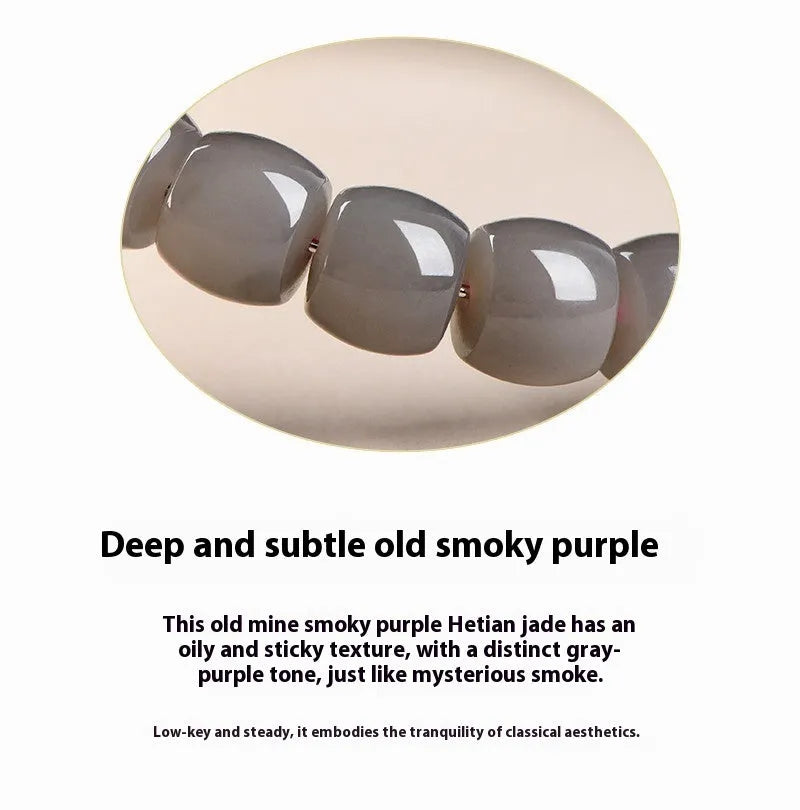 Straight cut Hetian jade bracelet in natural smokey violet colour on a wrist, showing polished 8x9mm beads.