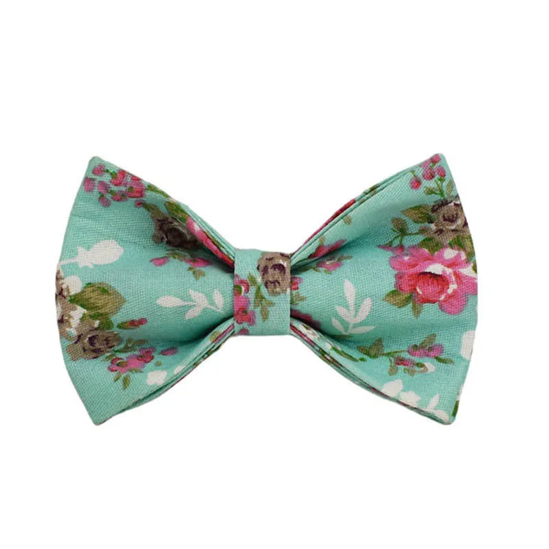 Fabric dog collar set with detachable green rose pattern bow, matching leash and vest
