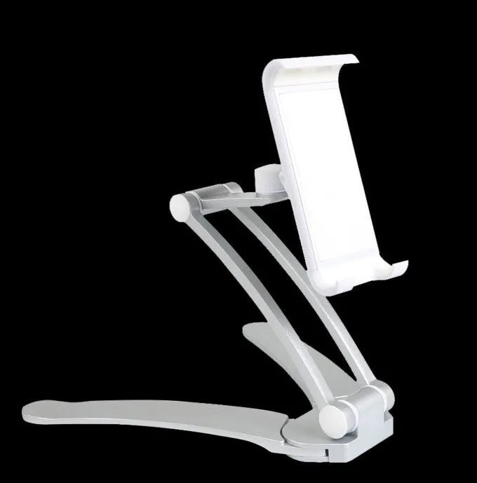 Silver aluminium alloy desktop tablet stand holding a tablet, showing its 360-degree rotation and adjustable chuck mechanism.