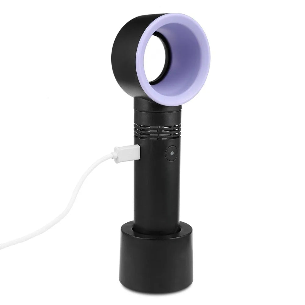 A compact portable bladeless fan with USB cable on a desk.